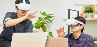 როგორ გარდაქმნა ტექნოლოგიებმა ჩვენი თვითგანვითარება Person using a laptop in a modern office or cafe setting, symbolizing remote education and digital lifestyle.