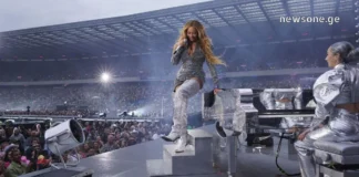 როგორ იქცა კონცერტები მოგზაურობის მთავარ მიზეზად A crowded live music concert at a large European stadium with bright stage lights.